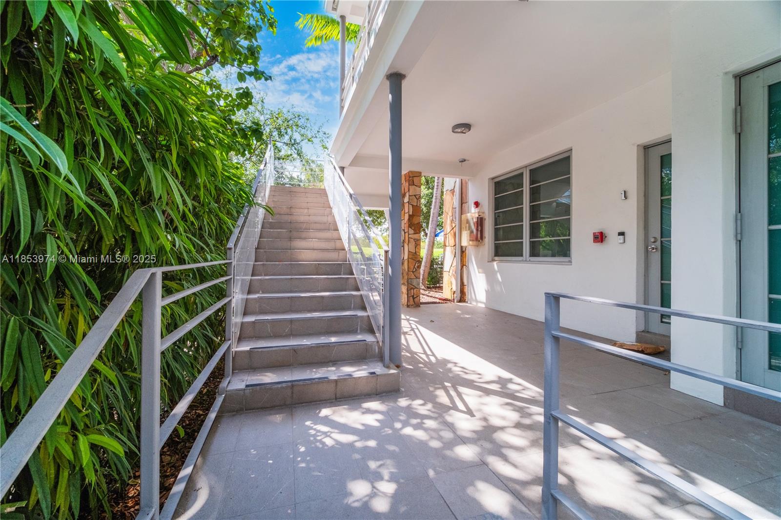 2021 Meridian Avenue, Unit 11 Miami Beach, FL 33139 - Photo 22 of 22 a view of house with stairs and wooden floor