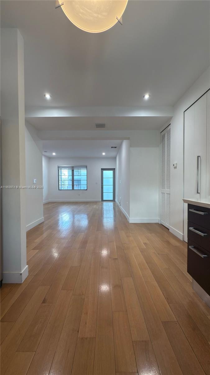 2021 Meridian Avenue, Unit 11 Miami Beach, FL 33139 - Photo 5 of 22 a view of empty room with wooden floor
