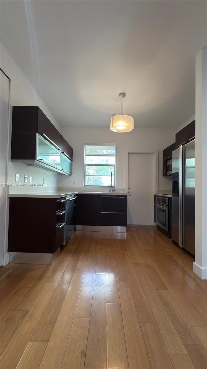 2021 Meridian Avenue, Unit 11 Miami Beach, FL 33139 - Photo 6 of 22 a view of kitchen with furniture and windows