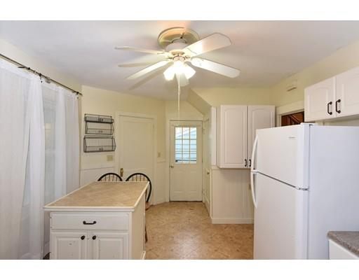 151 Cherry Street Ashland, MA 01721 - Photo 14 of 42 a kitchen with a refrigerator a sink and cabinets