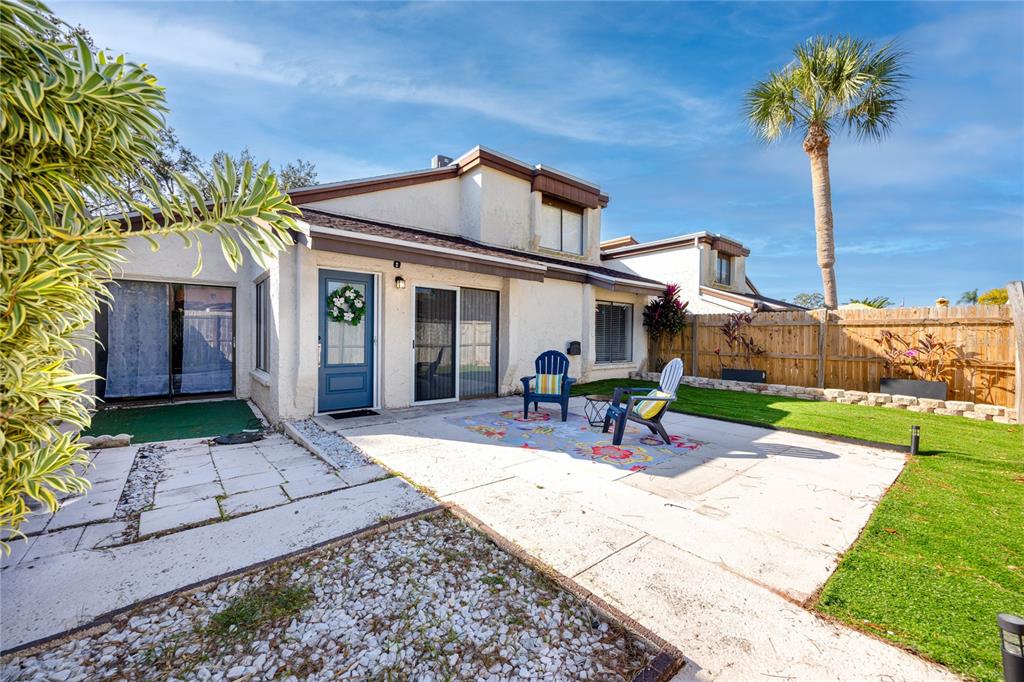 a view of a backyard with a patio