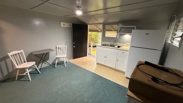 a bathroom with a sink a mirror and a shower