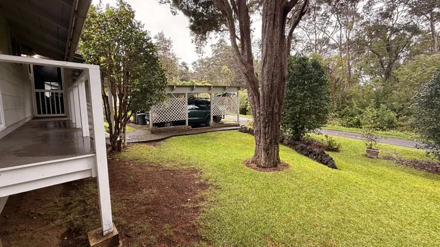 a view of backyard with swimming pool