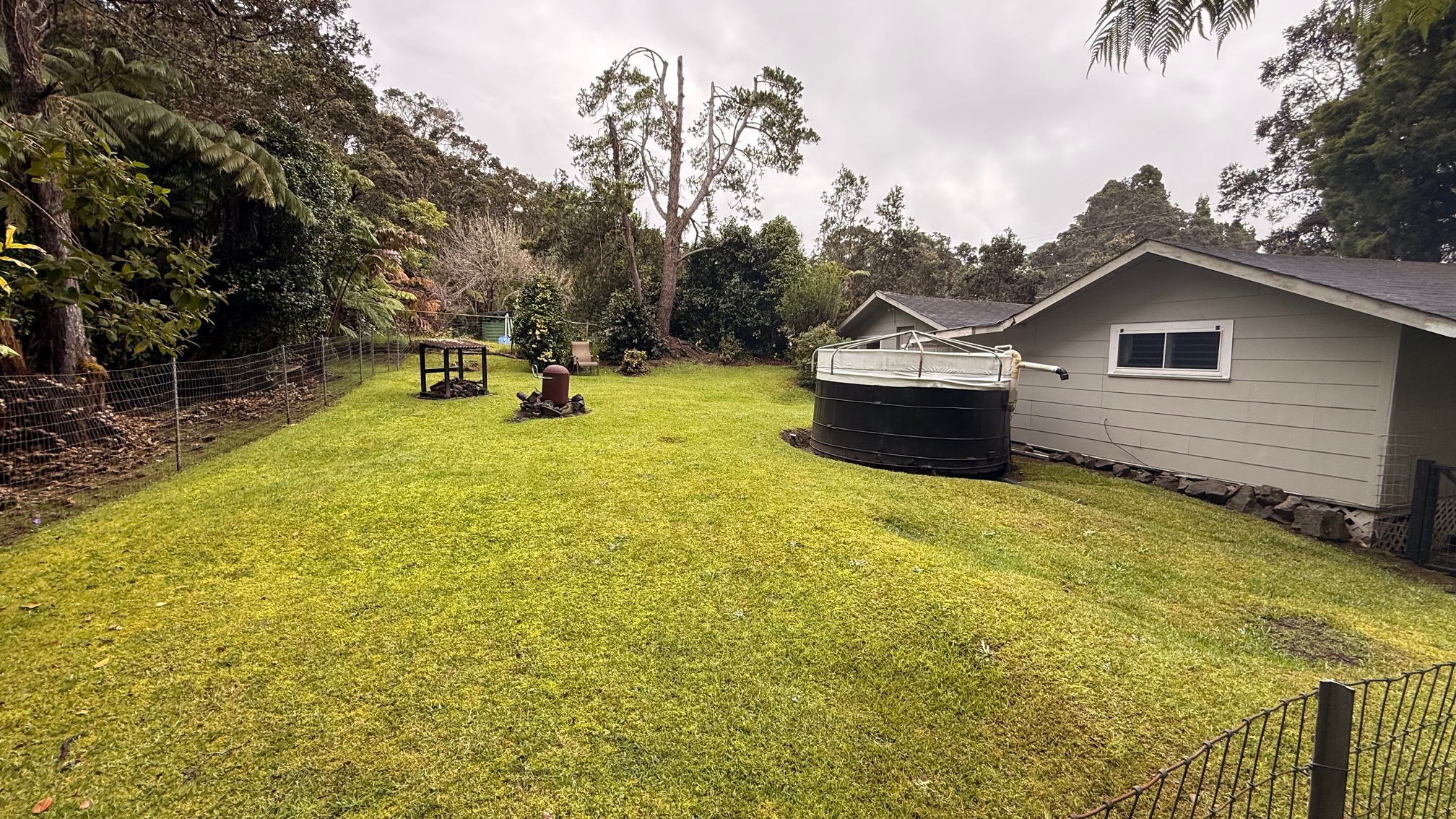 19-4113 Kalani Honua Loop Volcano, HI 96785 - Photo 22 of 28 a front view of a house with a yard