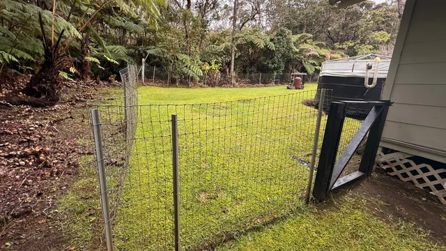 a view of a house with backyard