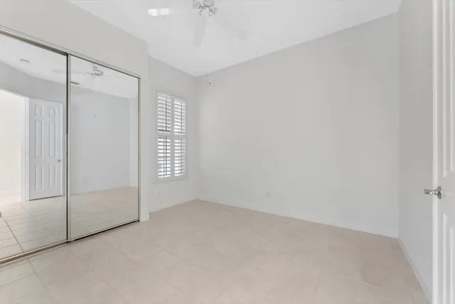 a bathroom with a double vanity sink mirror and shower