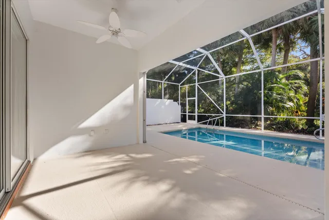 a view of a sink and dishwasher with white cabinets