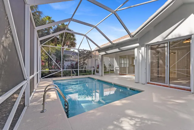 a view of a balcony with table and chairs