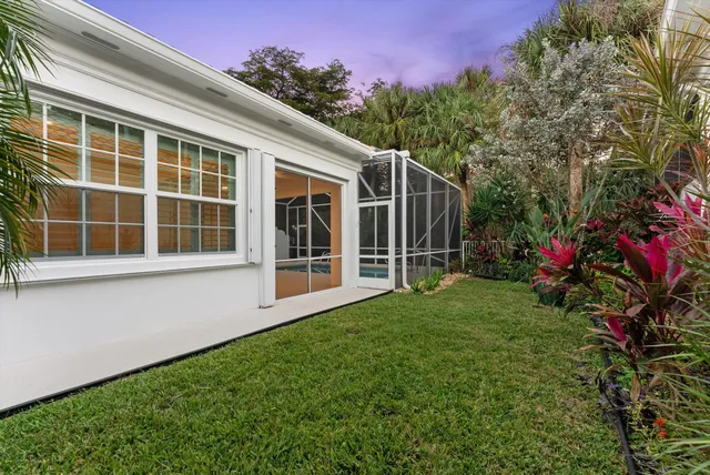 a view of a swimming pool with a glass door