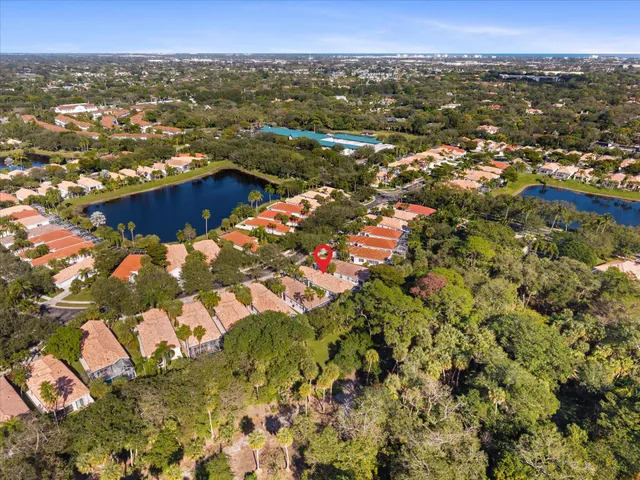 an aerial view of residential house with outdoor space and swimming pool
