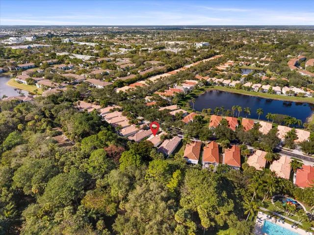 an aerial view of residential houses with outdoor space