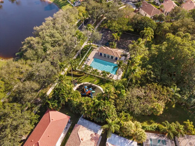 an aerial view of a houses with yard