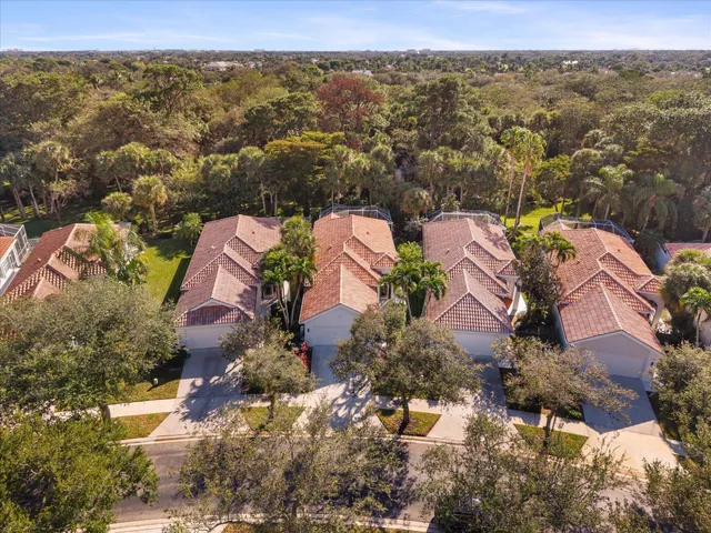 an aerial view of house with yard