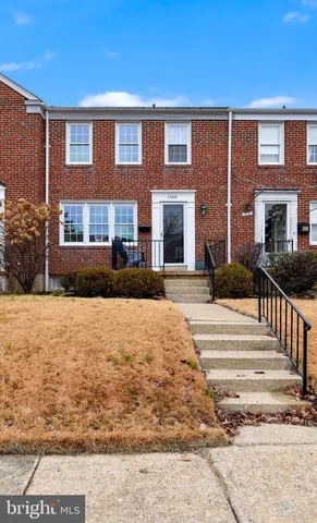 a view of a brick building with many windows