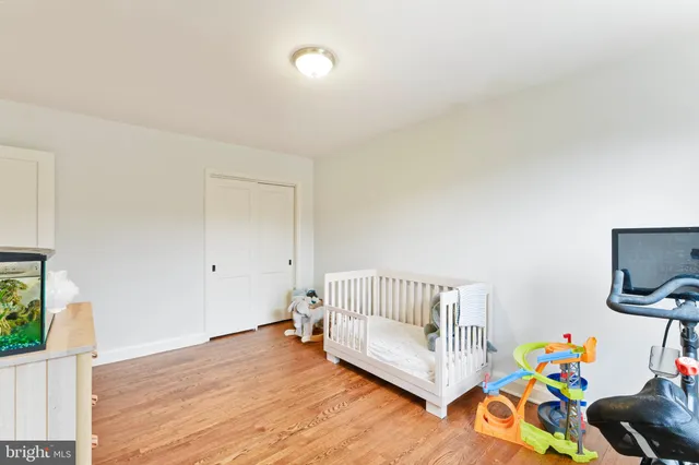 a bed room with a bed and a chandelier