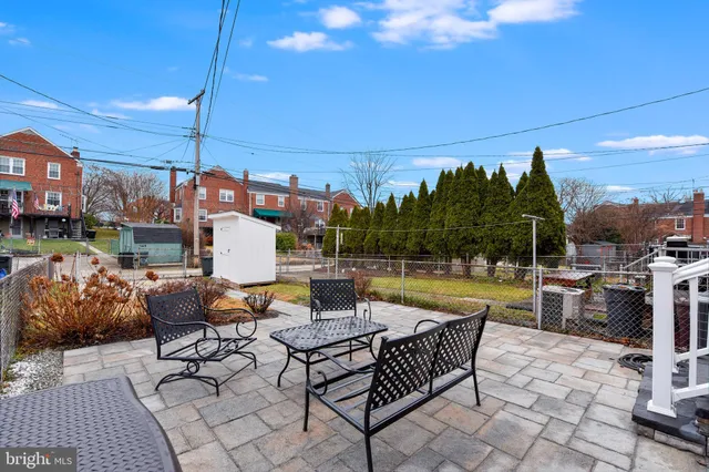 a view of a building with sitting area