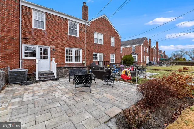 a view of a building with outdoor seating