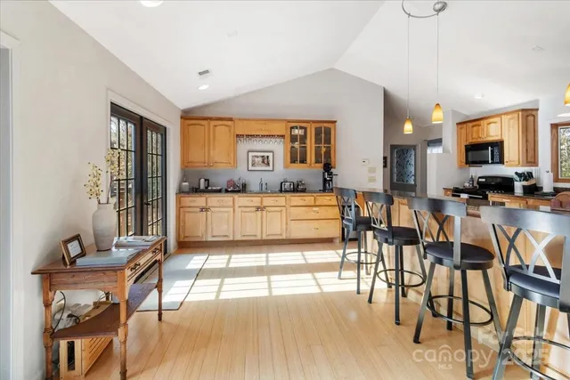 a living room with furniture and large windows