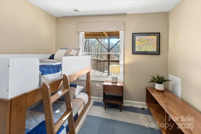 a bathroom with a granite countertop toilet sink and mirror