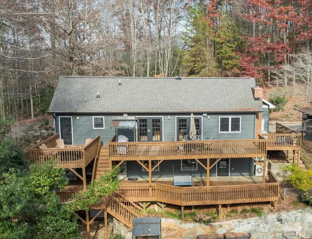 a aerial view of a house with large trees