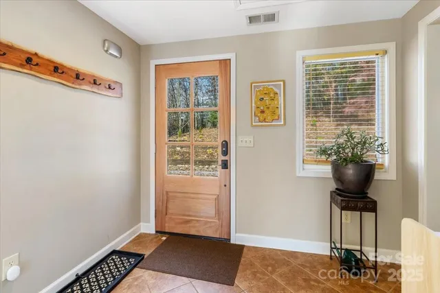 a view of a livingroom with furniture and window