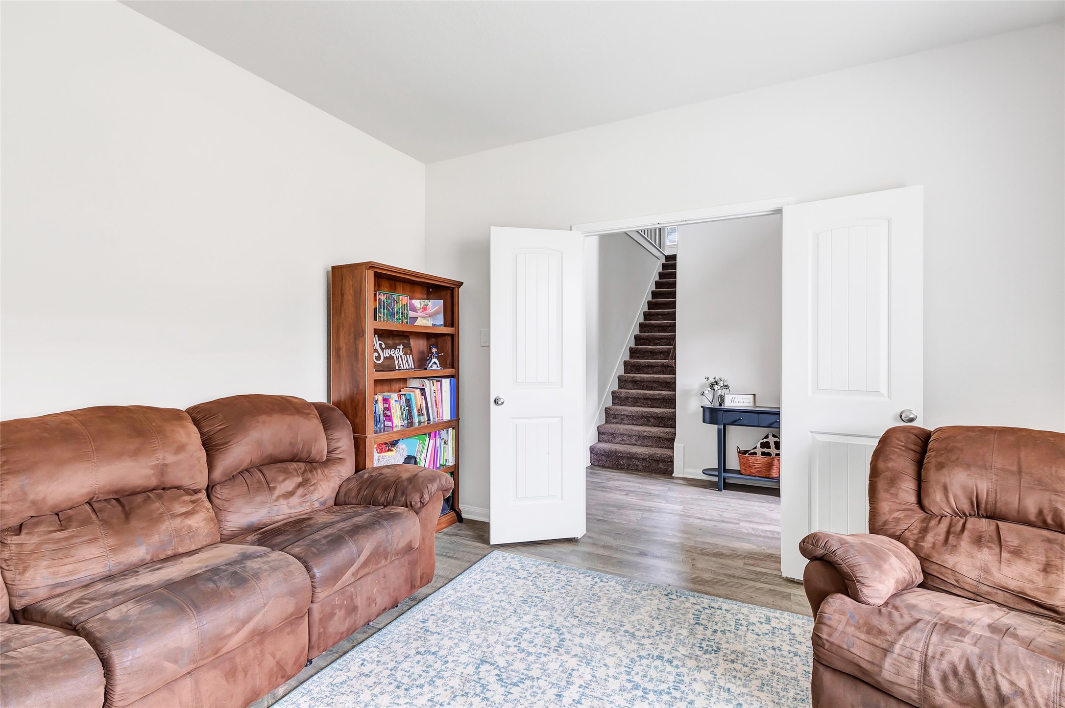 28511 Riverside Crest Lane Houston, TX 77336 - Photo 11 of 41 a living room with furniture and stairs