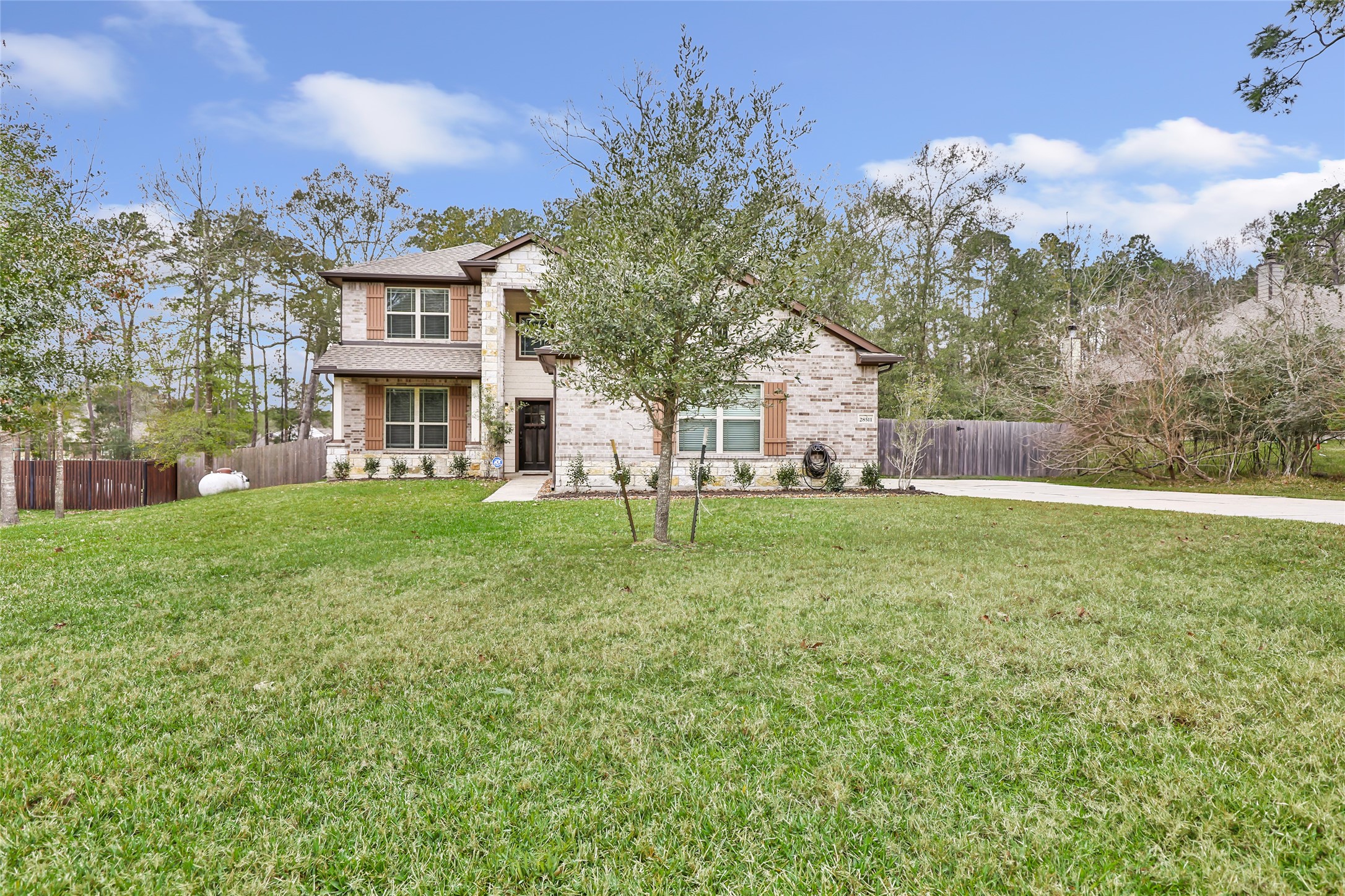 28511 Riverside Crest Lane Houston, TX 77336 - Photo 2 of 41 a view of a house with a yard