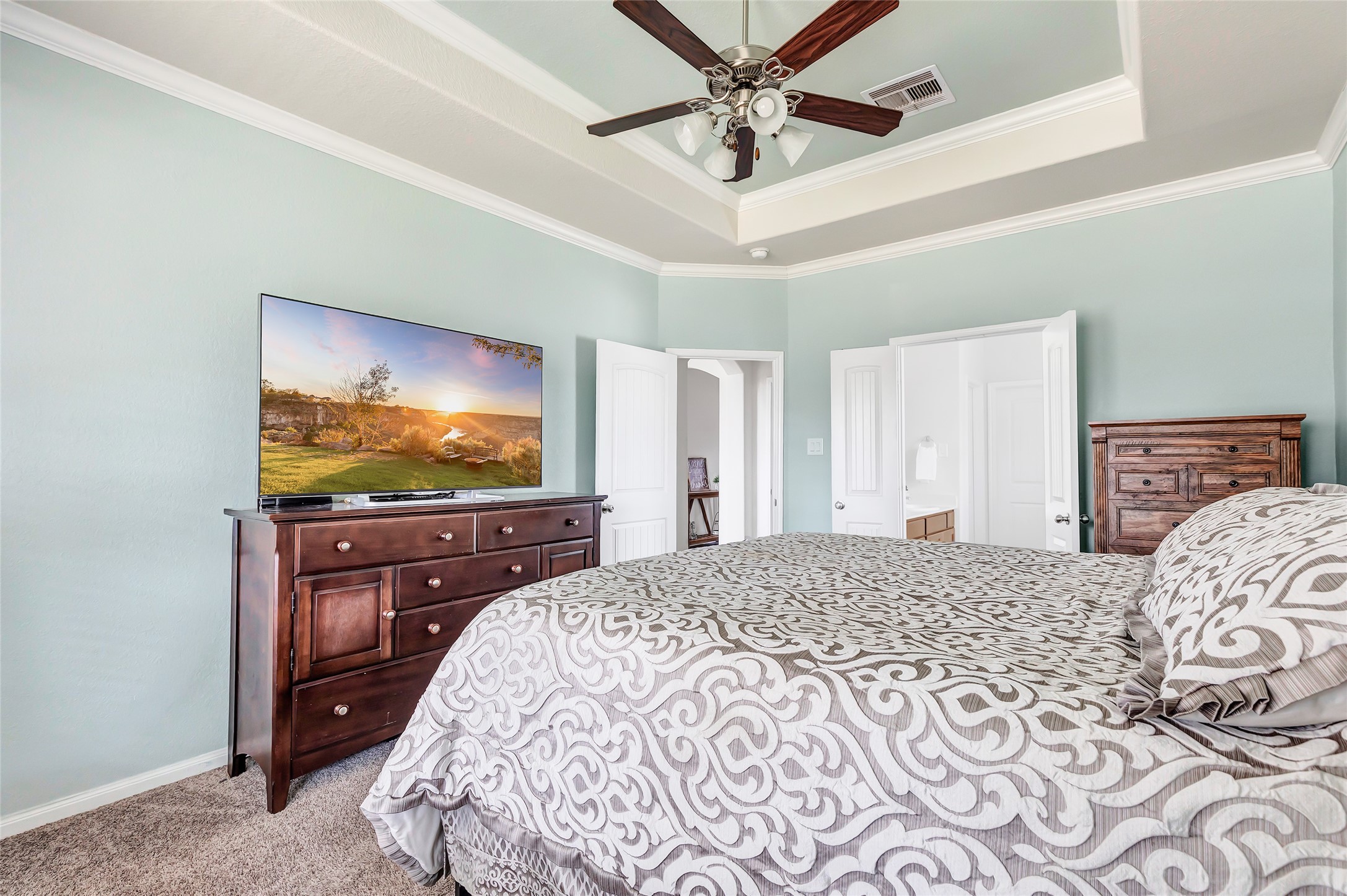 28511 Riverside Crest Lane Houston, TX 77336 - Photo 26 of 41 a bedroom with a bed and a flat screen tv