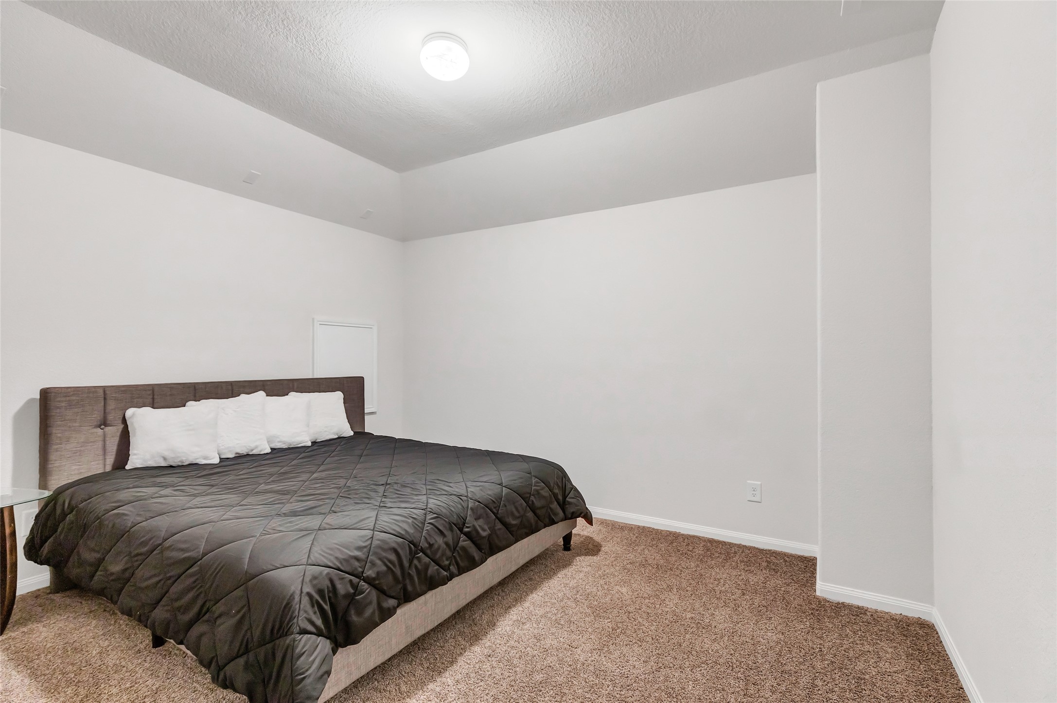 28511 Riverside Crest Lane Houston, TX 77336 - Photo 29 of 41 a bed sitting in a bedroom next to a window