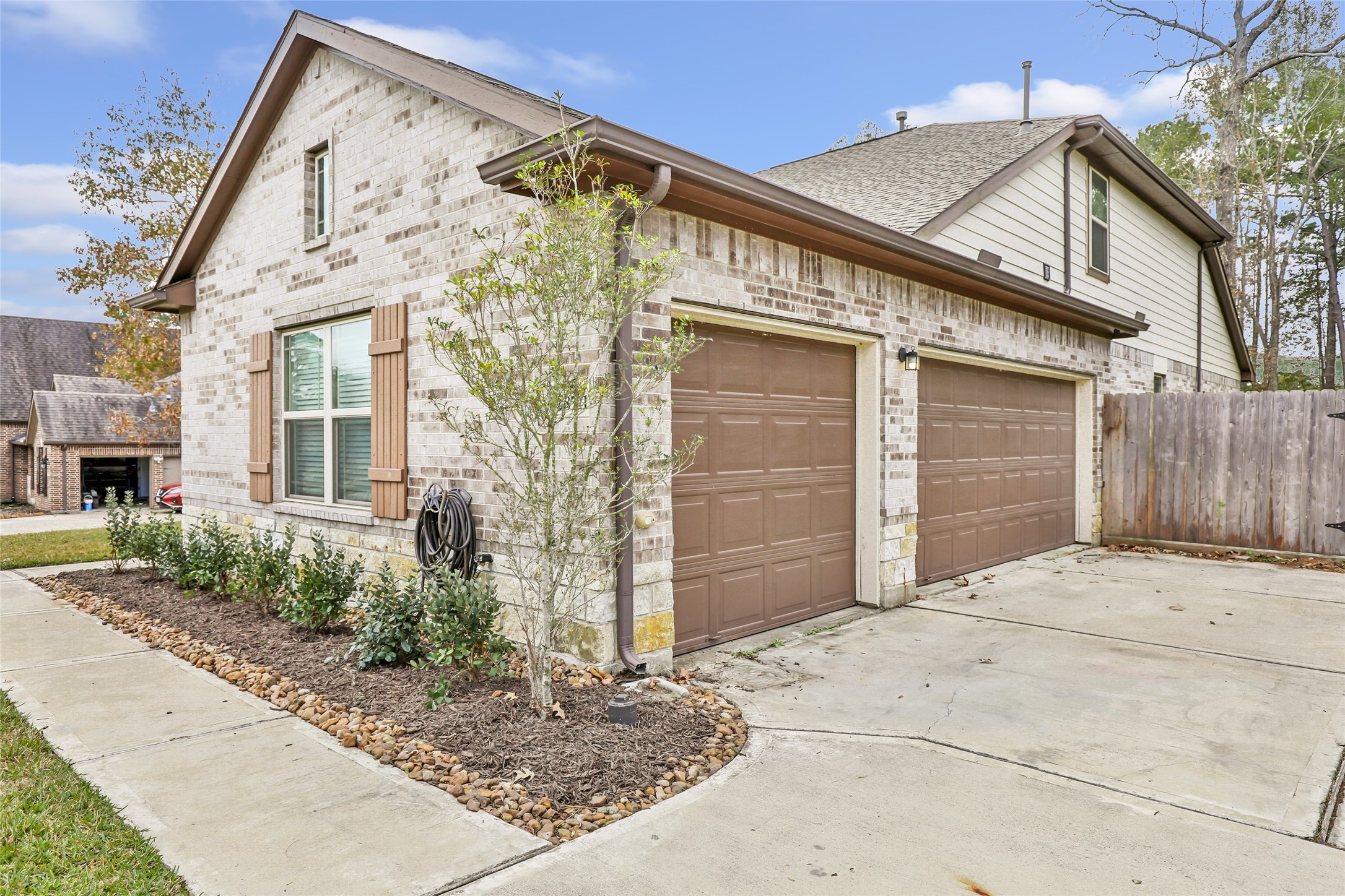 28511 Riverside Crest Lane Houston, TX 77336 - Photo 5 of 41 a front view of a house with garage