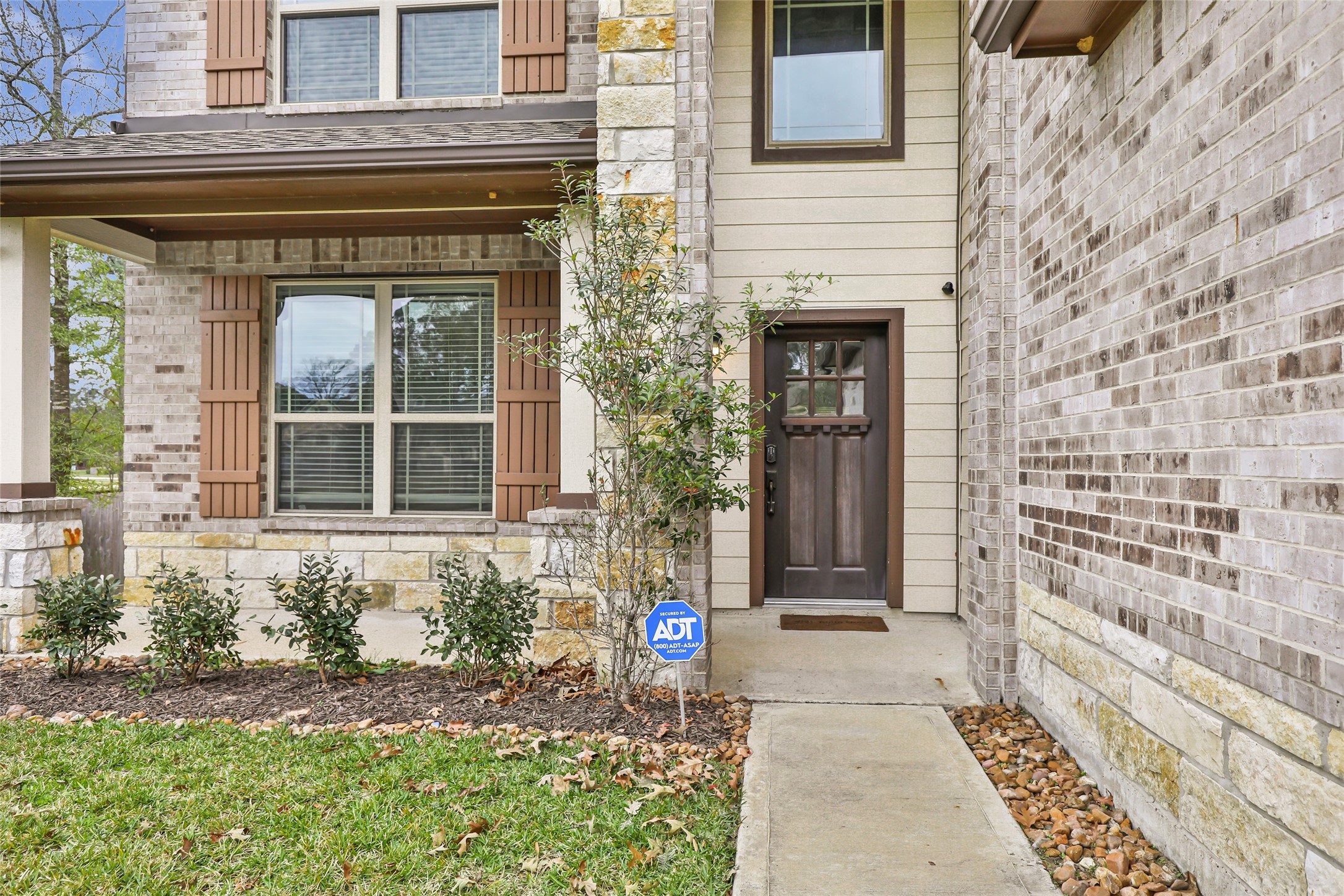 28511 Riverside Crest Lane Houston, TX 77336 - Photo 6 of 41 a front view of a house with a garden