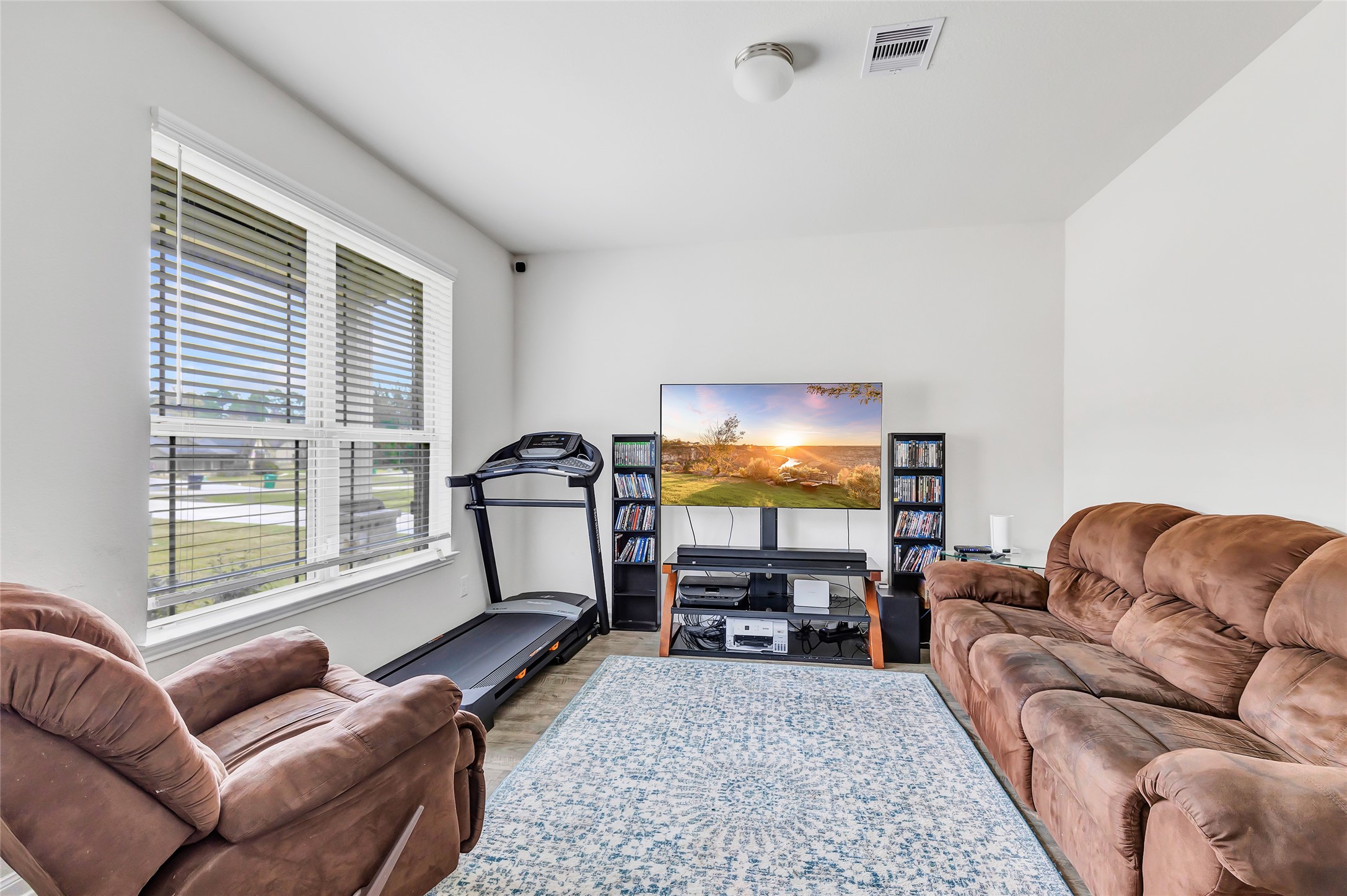 28511 Riverside Crest Lane Houston, TX 77336 - Photo 10 of 41 a living room with furniture a couch and a flat screen tv