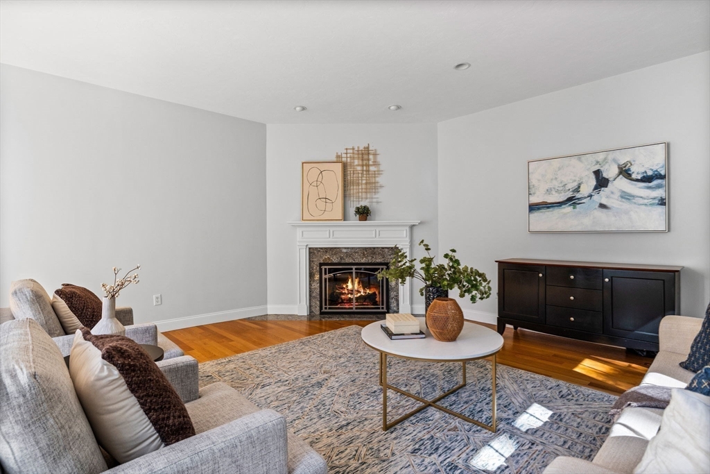 1 Fox Hunt Lane Winchester, MA 01890 - Photo 13 of 38 a living room with furniture a rug and a fireplace