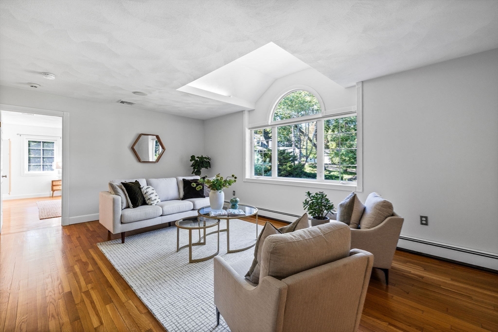 1 Fox Hunt Lane Winchester, MA 01890 - Photo 17 of 38 a living room with furniture and a large window