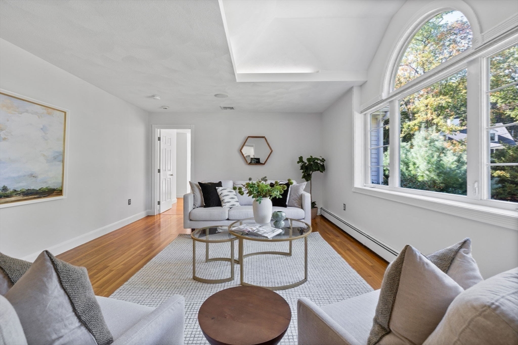 1 Fox Hunt Lane Winchester, MA 01890 - Photo 18 of 38 a living room with furniture and a large window