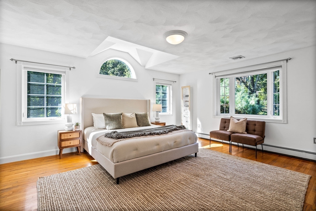 1 Fox Hunt Lane Winchester, MA 01890 - Photo 19 of 38 a bedroom with a bed and a couch