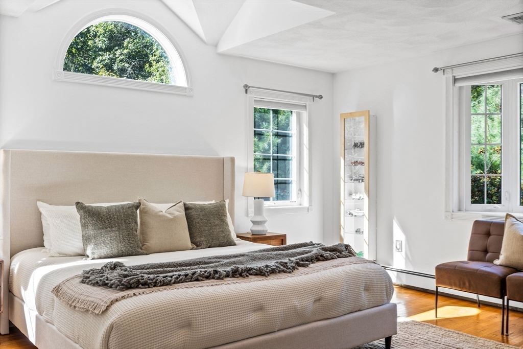 1 Fox Hunt Lane Winchester, MA 01890 - Photo 20 of 38 a bedroom with a bed and wooden floor