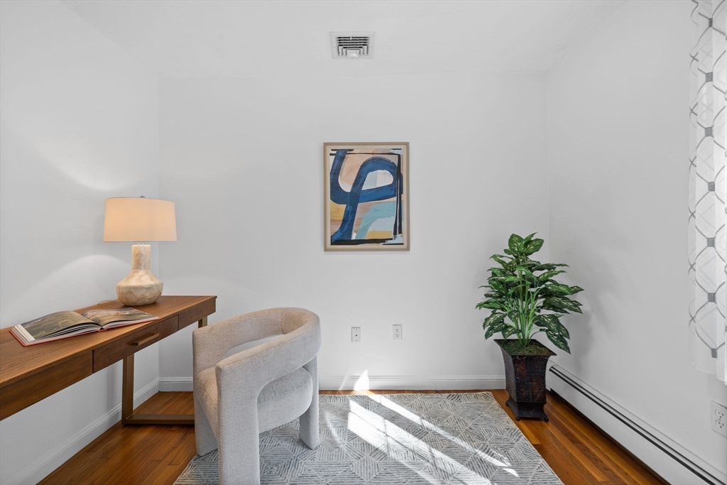 1 Fox Hunt Lane Winchester, MA 01890 - Photo 24 of 38 a workspace with furniture and a potted plant