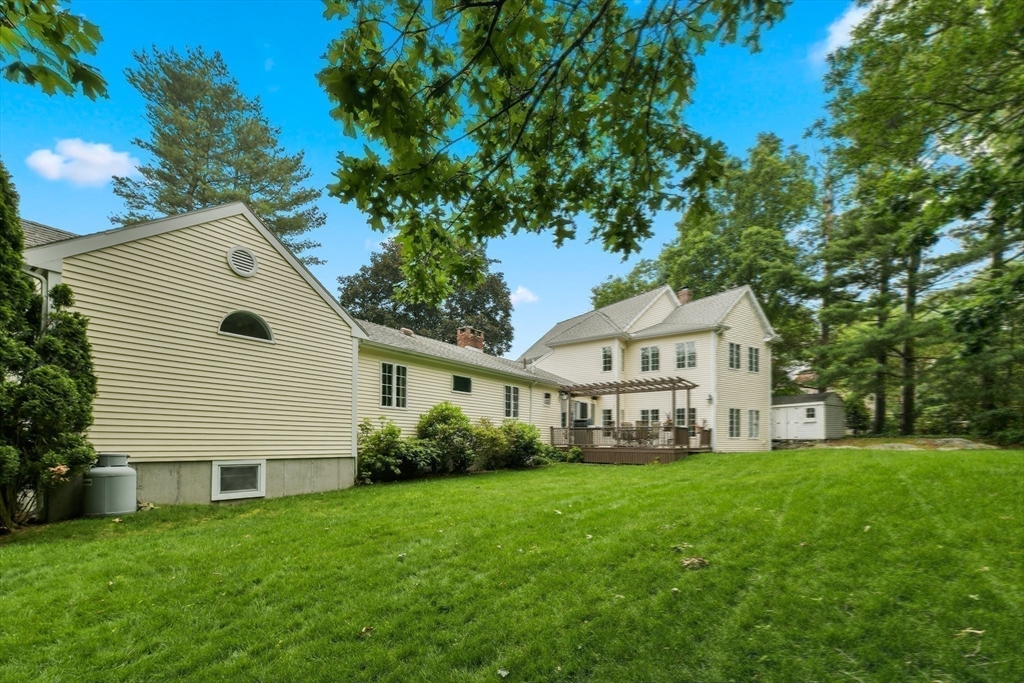 1 Fox Hunt Lane Winchester, MA 01890 - Photo 34 of 38 a front view of house with yard and green space