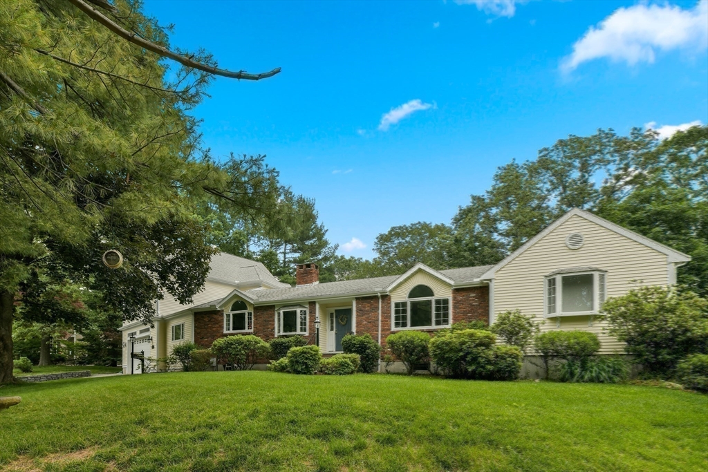 1 Fox Hunt Lane Winchester, MA 01890 - Photo 35 of 38 a front view of a house with a garden