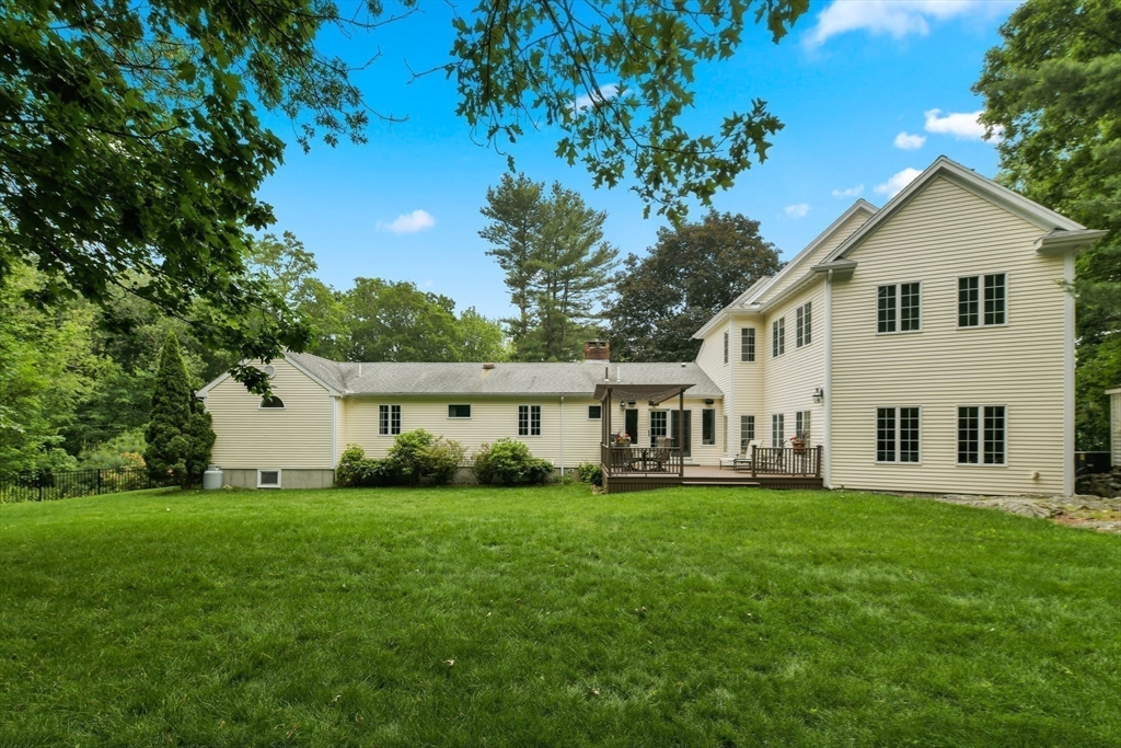 1 Fox Hunt Lane Winchester, MA 01890 - Photo 36 of 38 a view of a house with a yard
