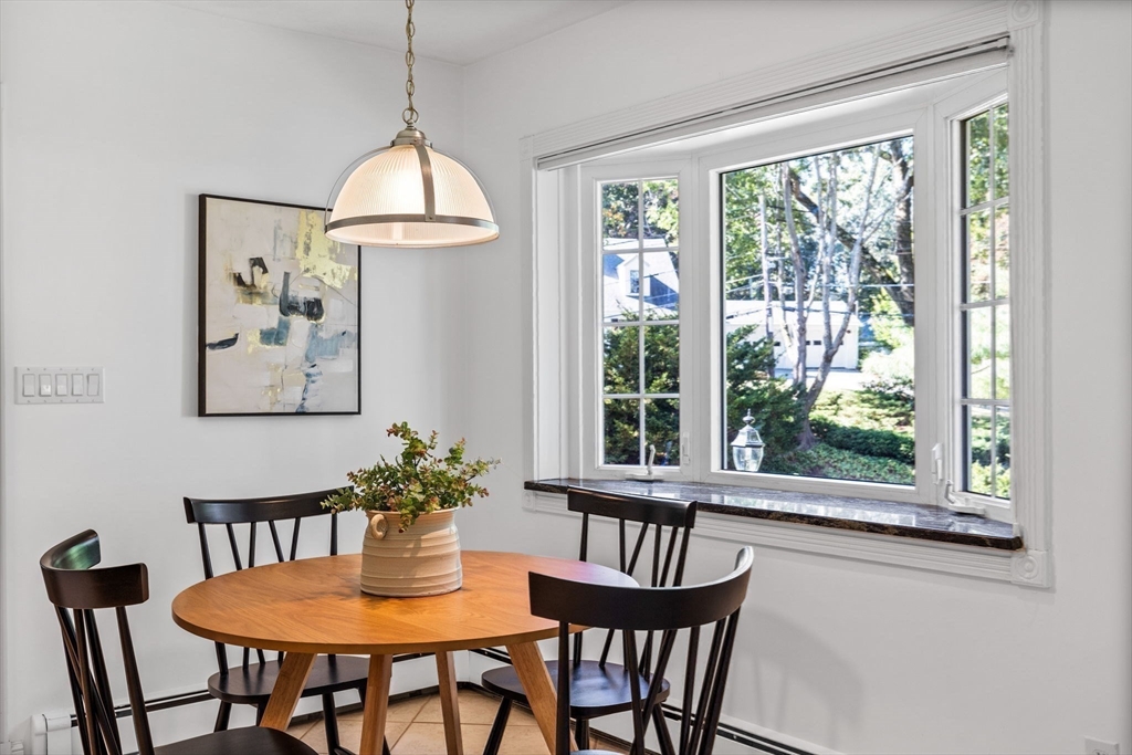1 Fox Hunt Lane Winchester, MA 01890 - Photo 8 of 38 a dining room with furniture a window and a chandelier
