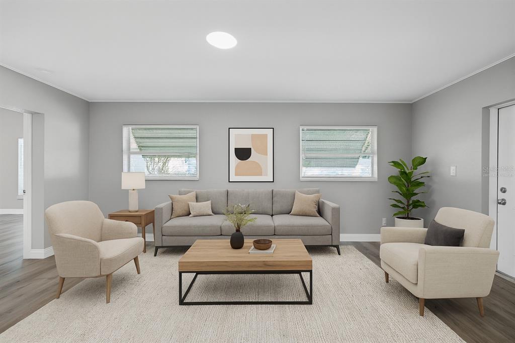 5046 99th Way North St. Petersburg, FL 33708 - Photo 3 of 41 a living room with furniture and a large window