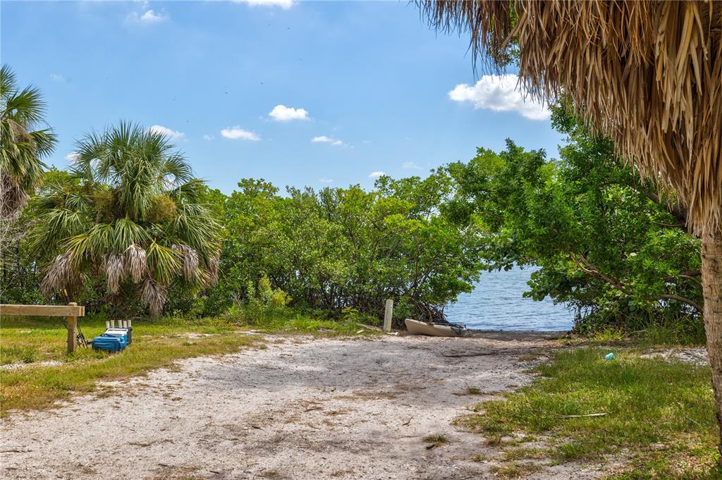 5046 99th Way North St. Petersburg, FL 33708 - Photo 40 of 41 a view of a yard with swimming pool