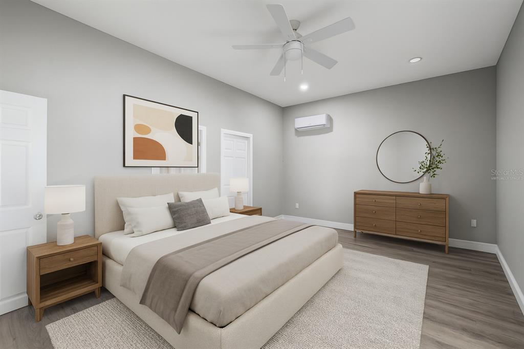 5046 99th Way North St. Petersburg, FL 33708 - Photo 5 of 41 a bedroom with a bed and a chandelier