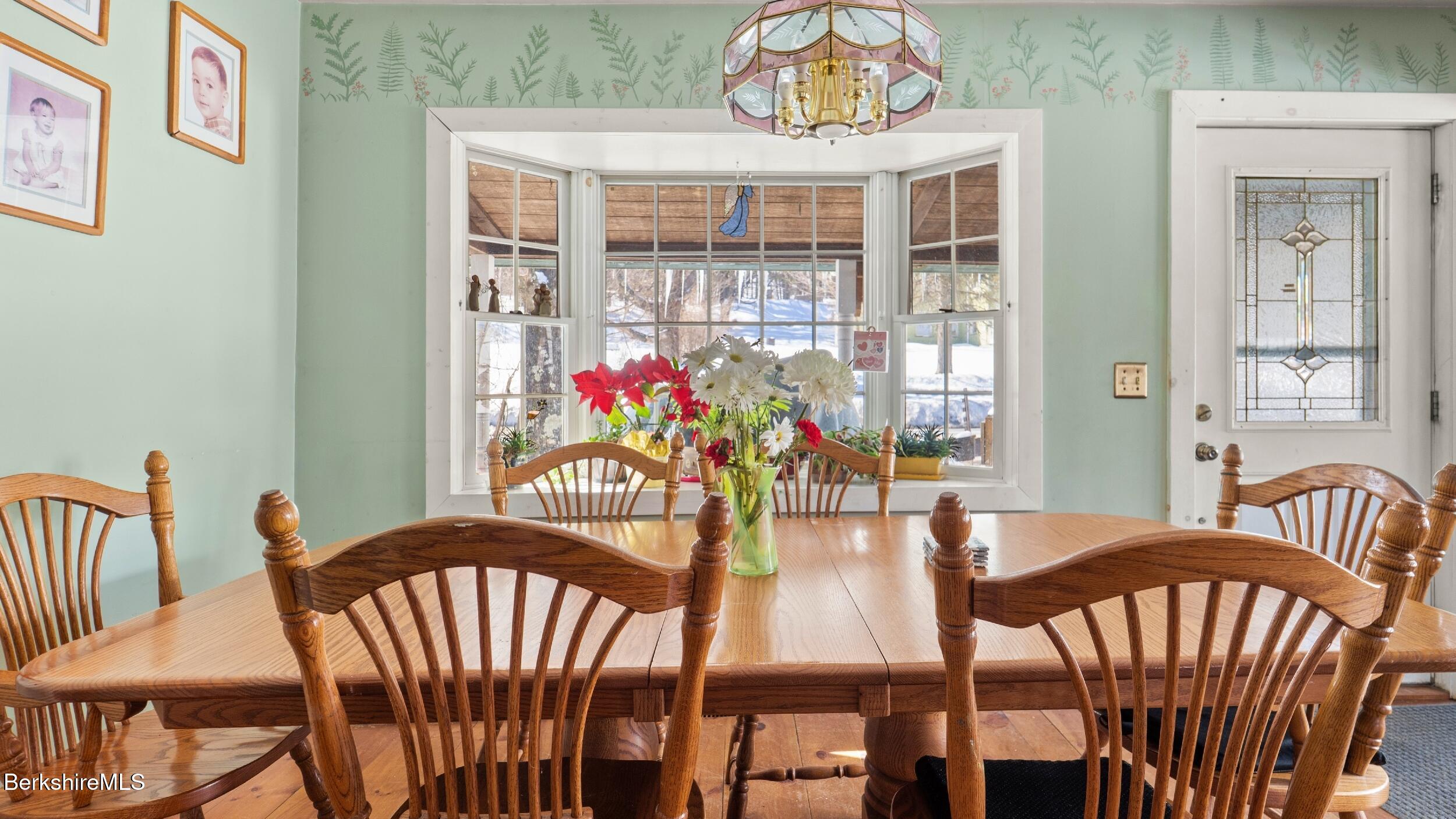 93 South Main Road Otis, MA 01253 - Photo 11 of 27 a view of a dining room with furniture window and outside view