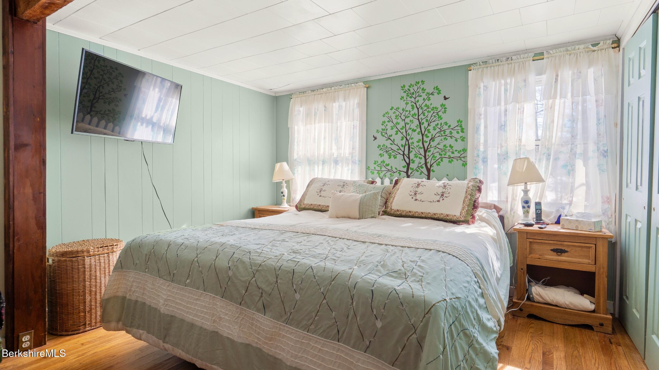93 South Main Road Otis, MA 01253 - Photo 13 of 27 a bed room with a bed and a tv