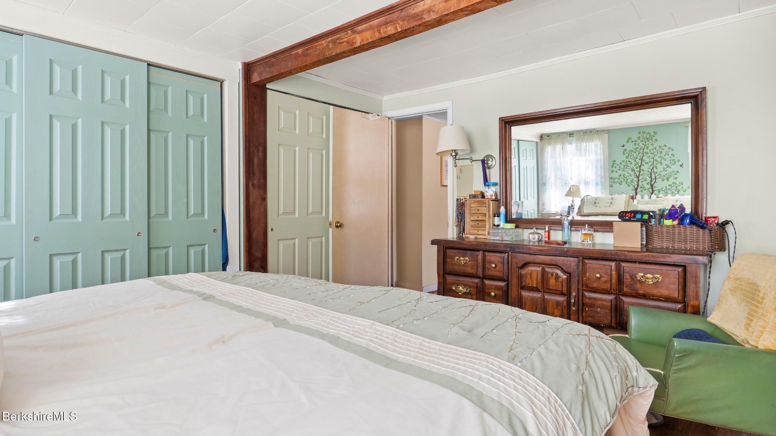 93 South Main Road Otis, MA 01253 - Photo 14 of 27 a bedroom with a bed and a large window