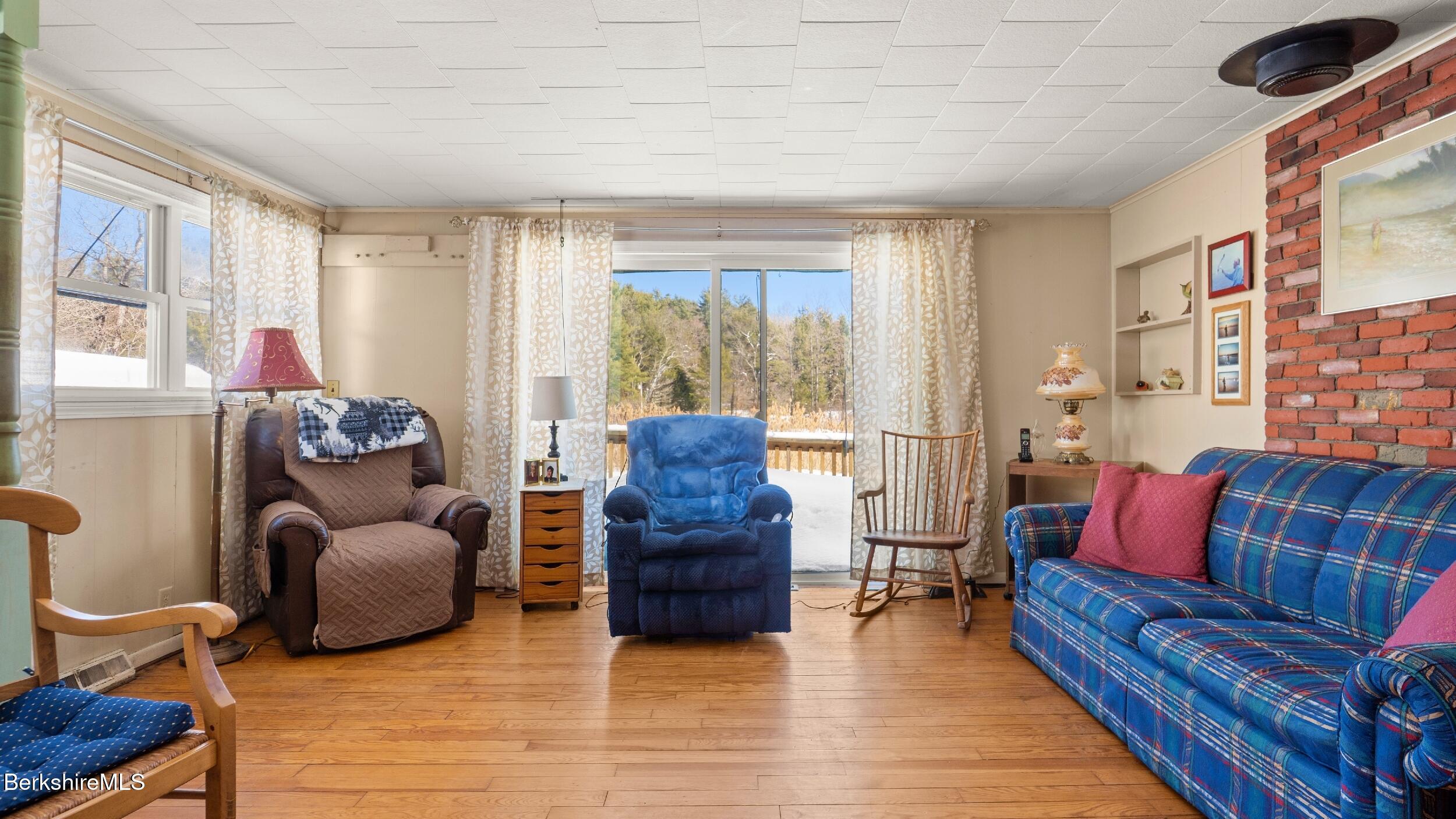 93 South Main Road Otis, MA 01253 - Photo 20 of 27 a living room with furniture and a large window