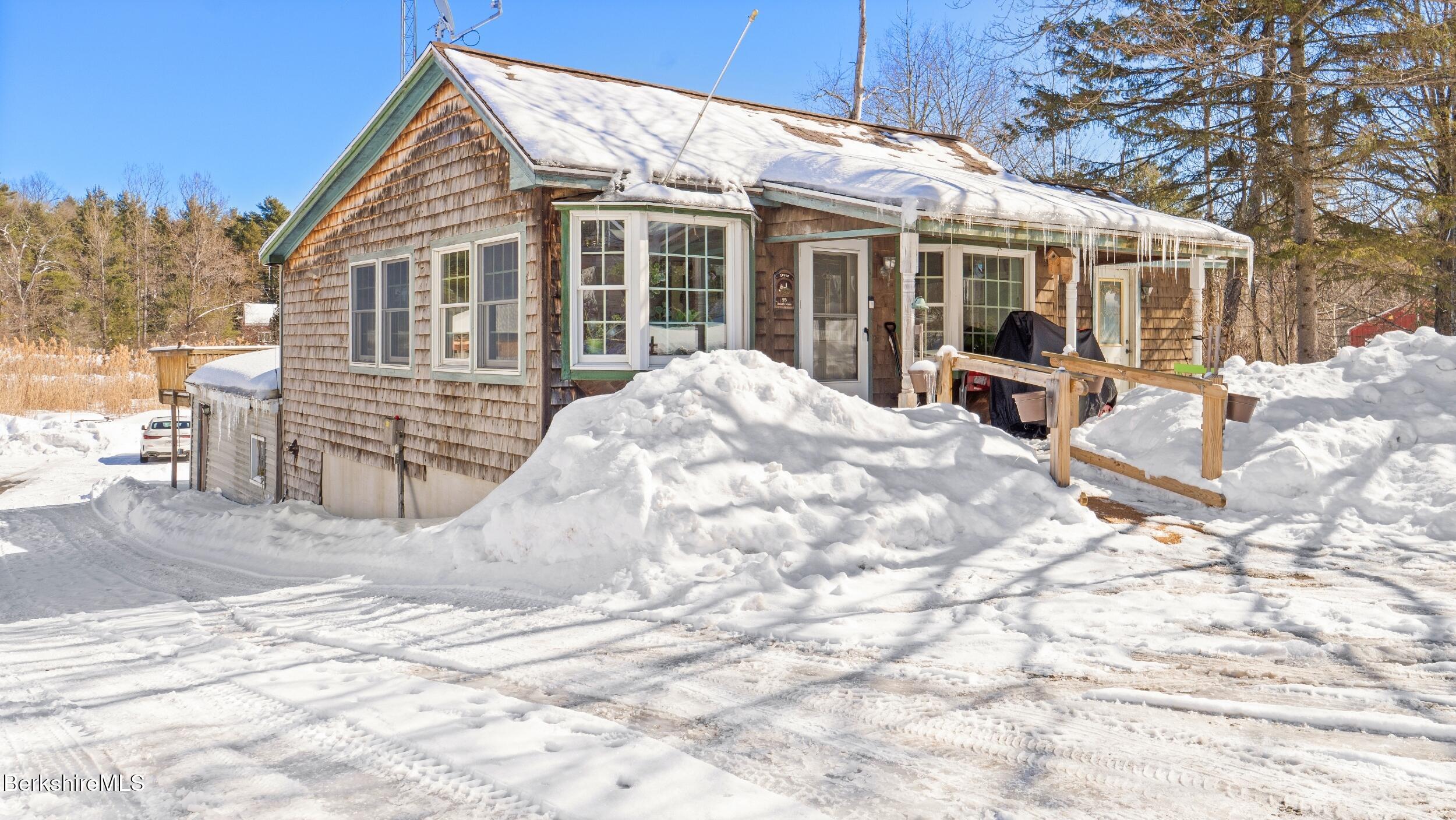 93 South Main Road Otis, MA 01253 - Photo 2 of 27 a view of a house with backyard and sitting area